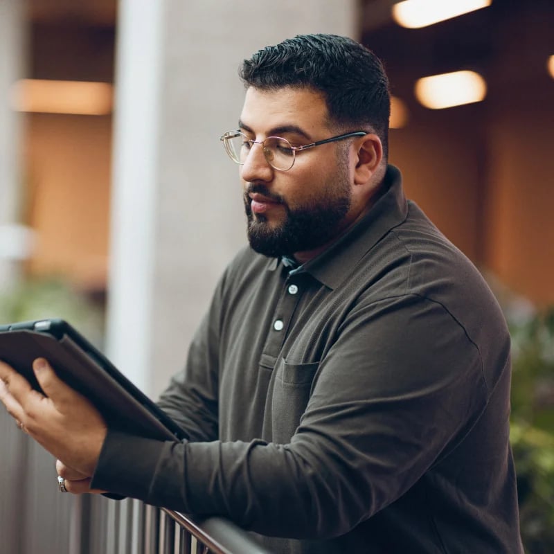 hr dashboard male employee holding tablet