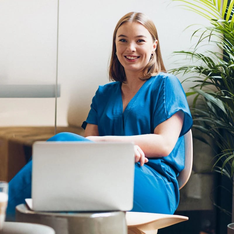 hr workflows female employee smiling