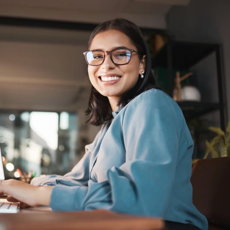 payroll output checker female facing the camera smiling